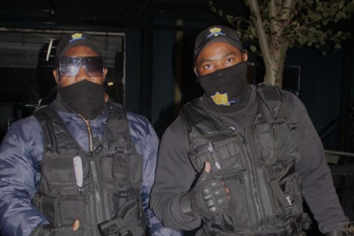Business security guards outside a building